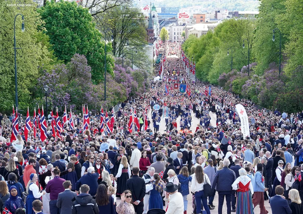 Karl Johan gate street packed with festive parade on National Day in Oslo Norway on May 17th 2026