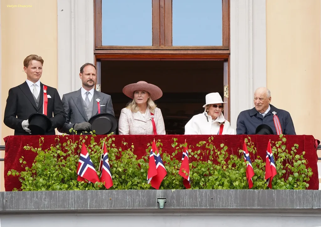 Royal Family on the Royal Palace balcony greets children parade with King Harald V and Queen Sonja in Oslo Norway on May 17th 2026