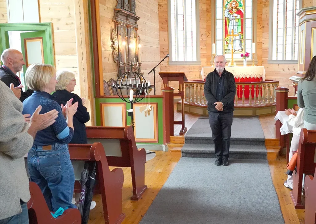 Organ Kaare Nordstoga at Fortun church, applause, Norway 2026. Photo by Vadim Chuprina.
